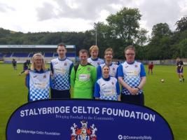 Community Chair Judi Kelly presents Stalybridge Celtic Blues with their new kit.